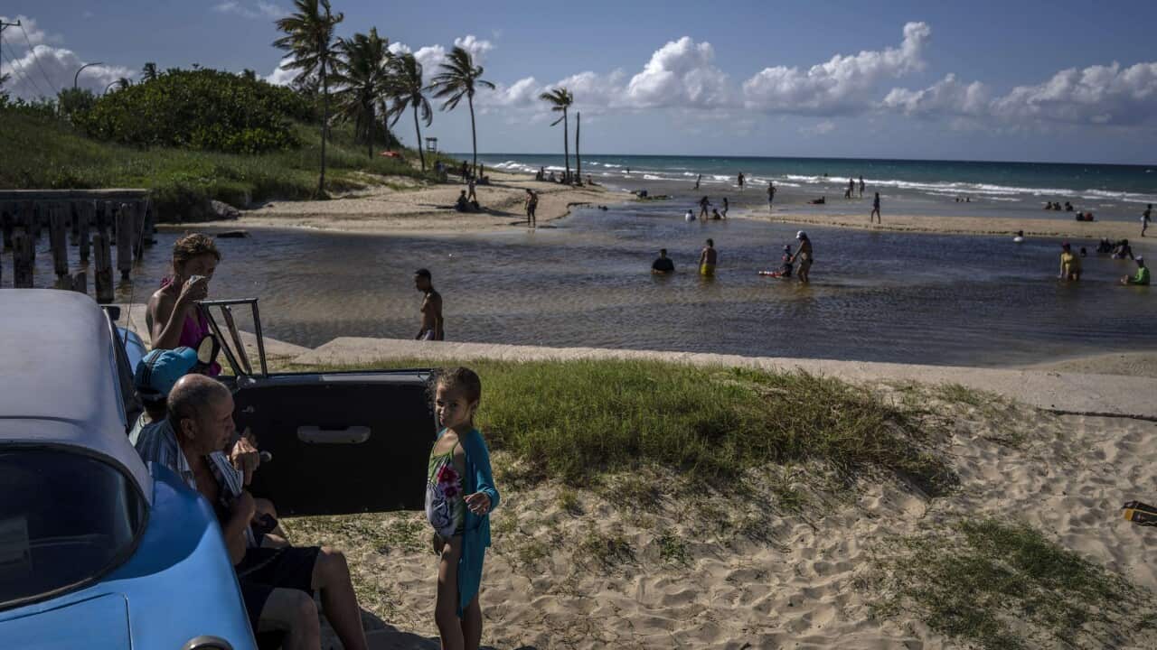 People enjoy a day at Boca Ciega beach on the outskirts of Havana, Cuba