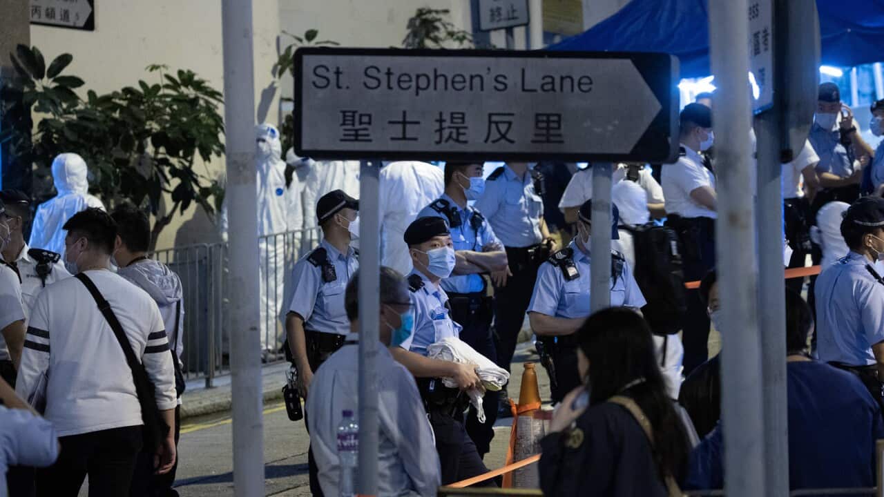 Civil servants take part in an ‘ambush-style lockdown’ in Hong Kong, China, 15 March 2021.