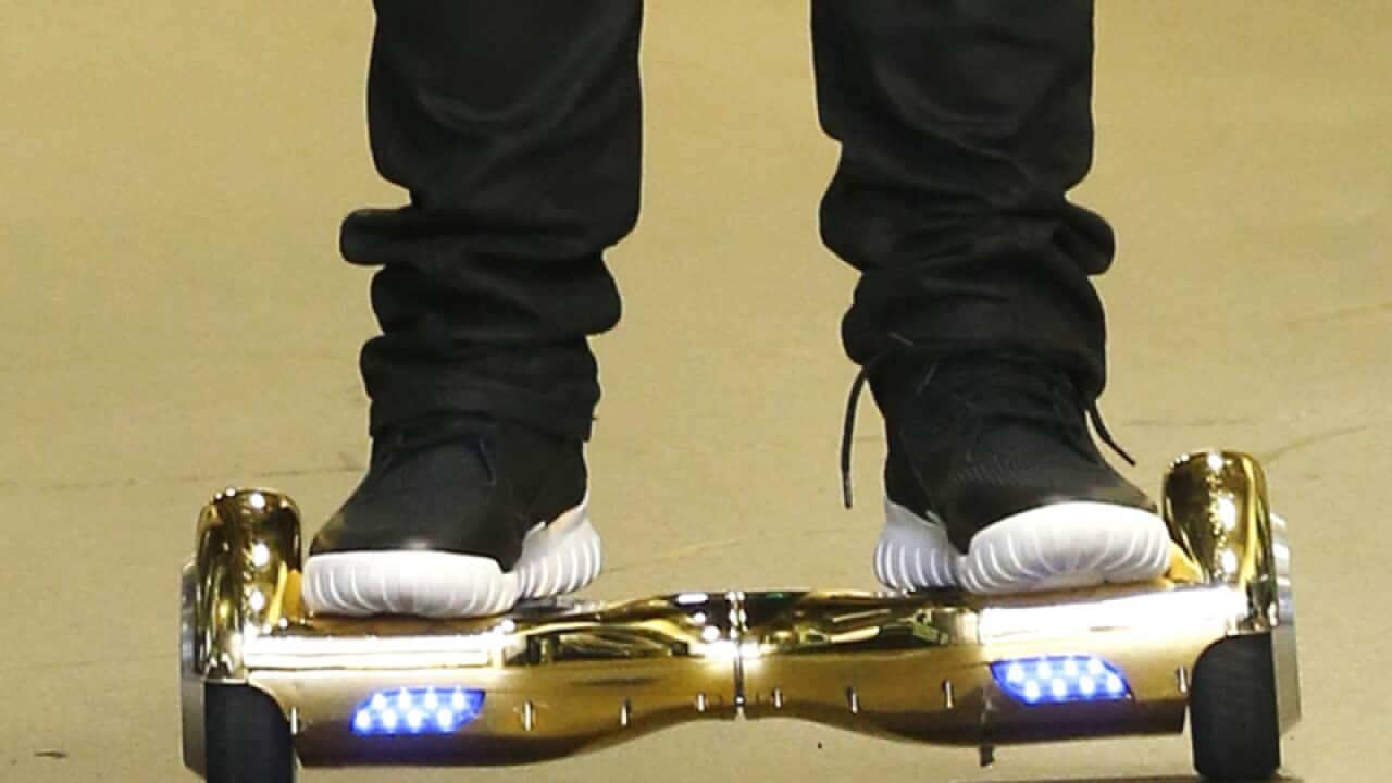 A man rides a hoverboard