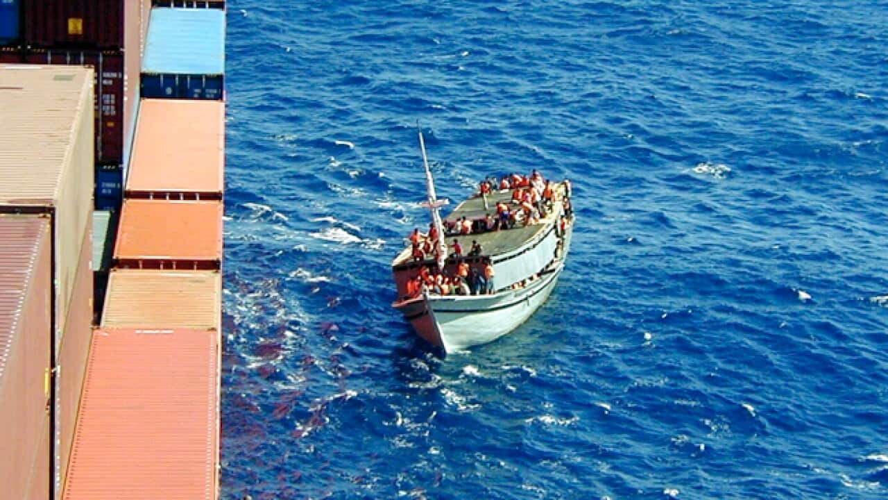 Tampa_alongside_boat_110826_B_aap_872405008