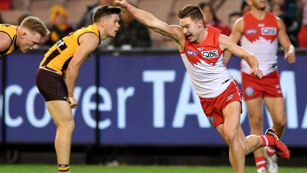 Ben Ronke of the Swans celebrates after kicking his sixth goal.