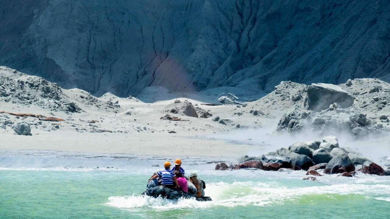 A rescue boat leaving White Island following the eruption of the volcano, New Zealand.