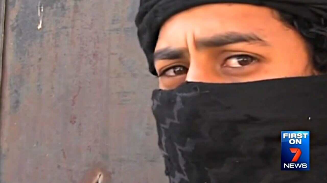 Australian man identified as Abu Ousama, who Channel Seven reports is fighting in Syria as a brigade combat medic. (Screenshot/Channel 7)