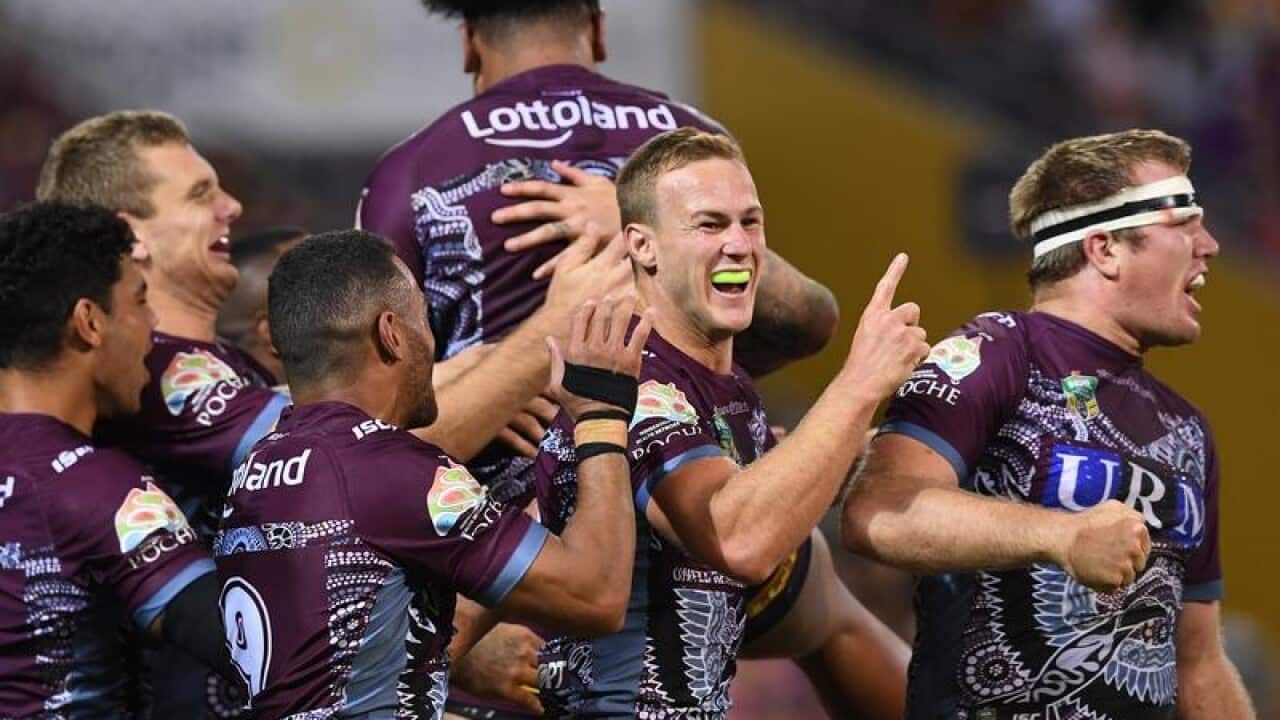Sea Eagles celebrate a try.
