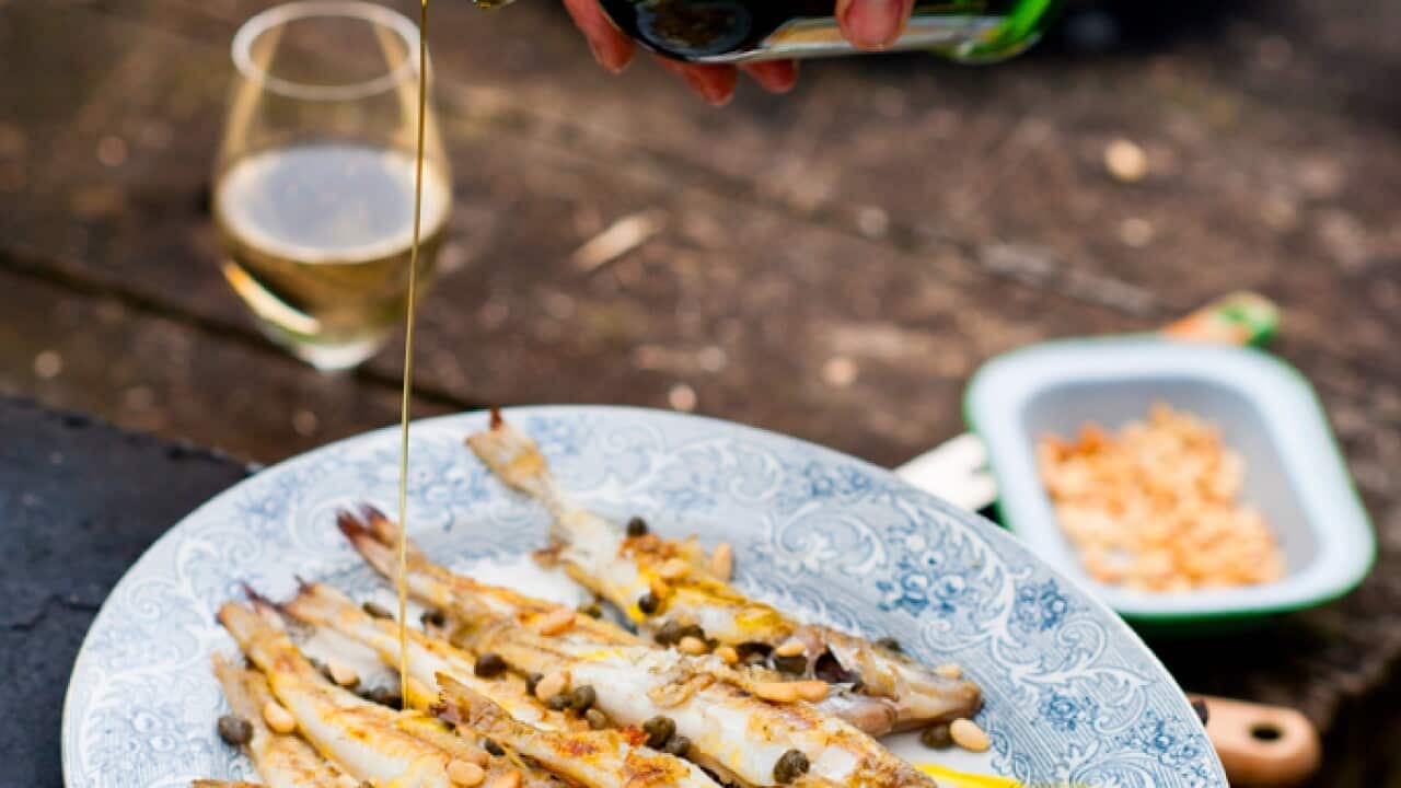 Barbecued whole whiting with capers and pine nuts