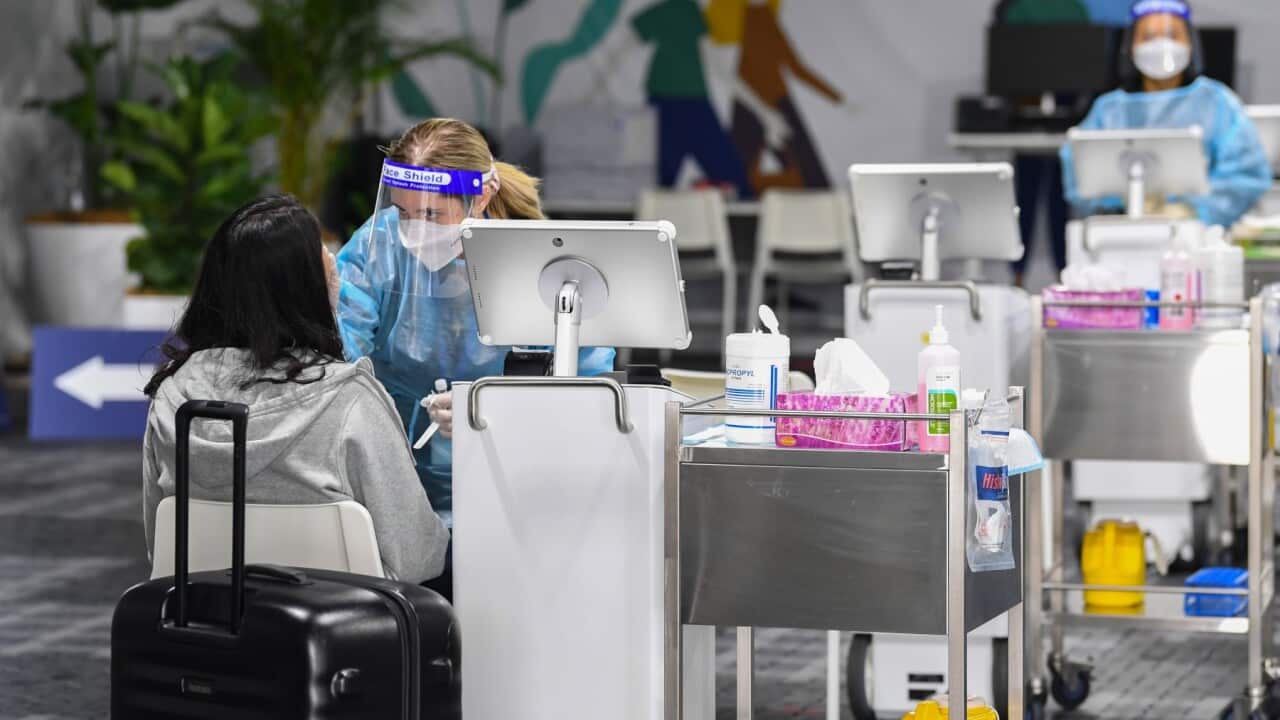 SYDNEY, AUSTRALIA - NOVEMBER 28: Passengers undergo COVID-19 tests at the Histopath Diagnostic Specialists pre-departure area at Sydney International Airport on November 28, 2021 in Sydney, Australia.