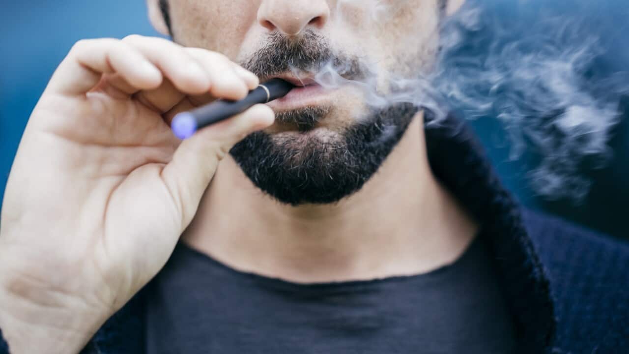 Portrait of man smoking an electronic cigarette