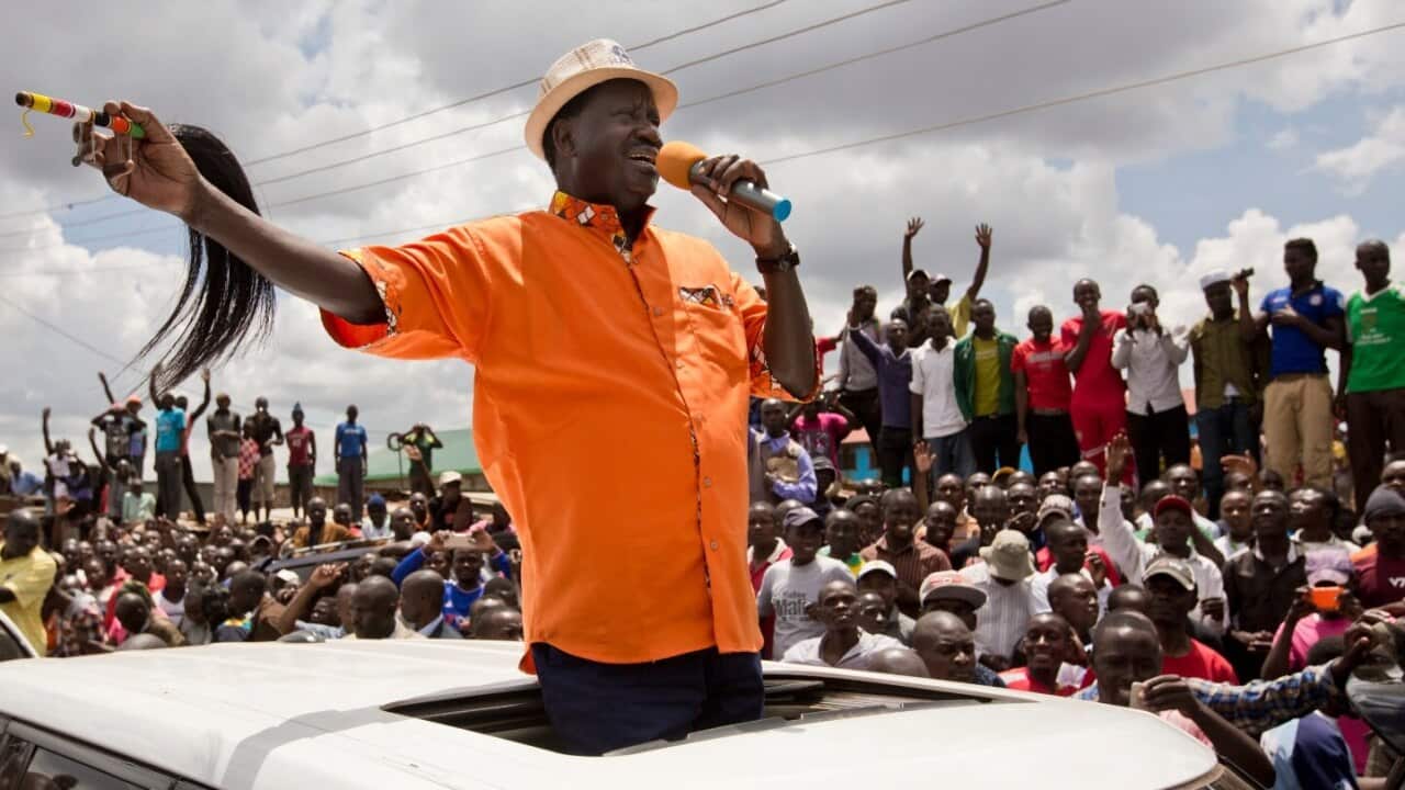 Opposition leader Raila Odinga greets his supporters after attending a church service in the slum of Kawangware in Nairobi, Kenya, Sunday, Oct. 29, 2017.