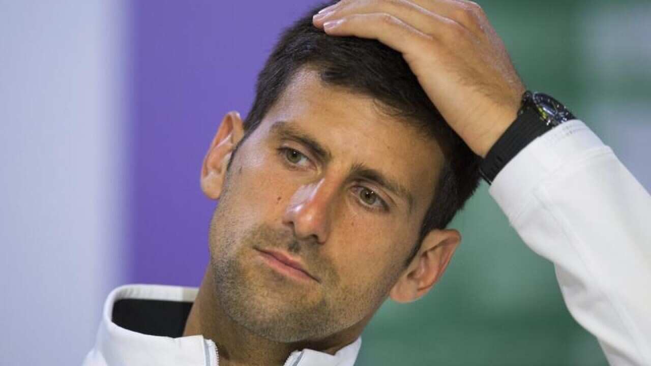 Novak Djokovic as he gestures during a press conference