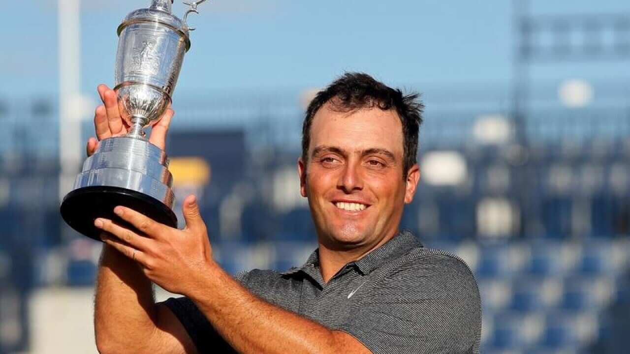 Italy's Francesco Molinari with The Claret Jug after winning.