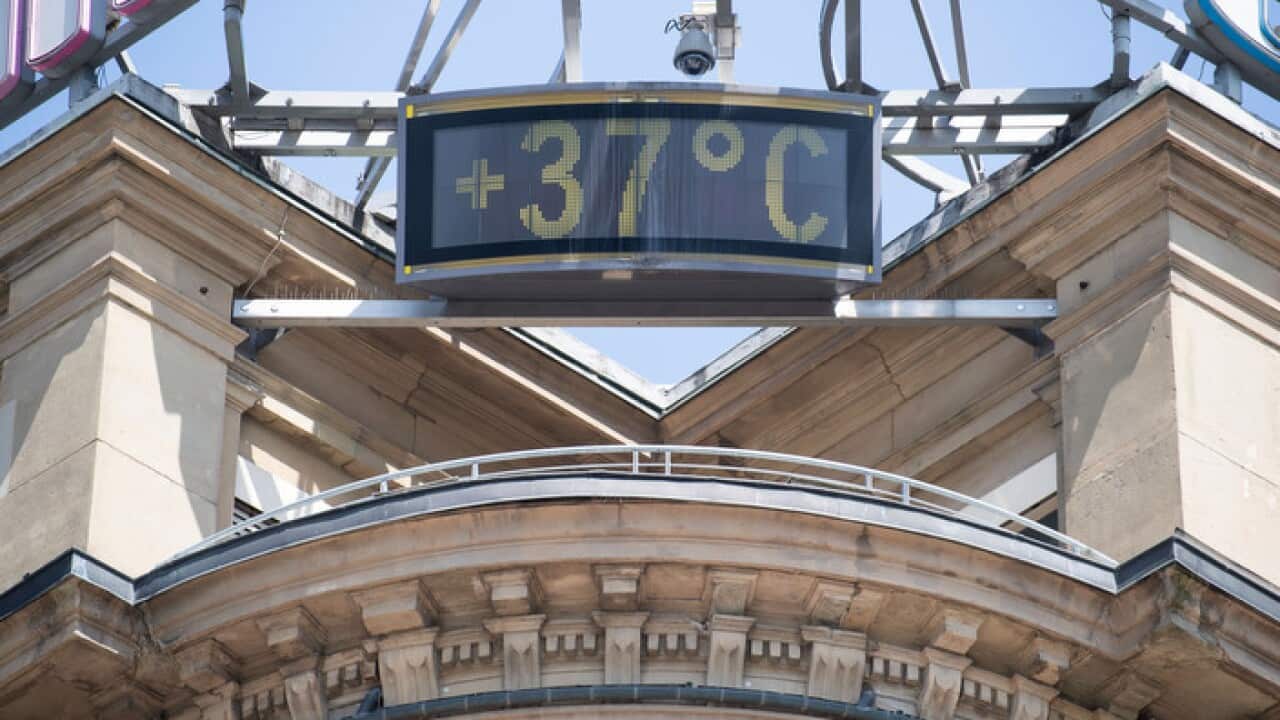 A sign shows 37 degrees Celsius at a building in the city of Stuttgart, Germany
