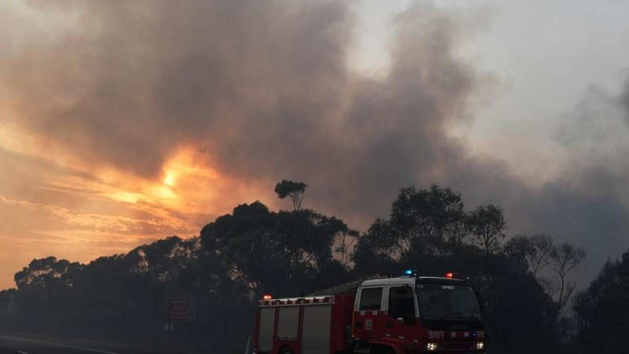 A CFA fire crew is seen along the Princes Highway.