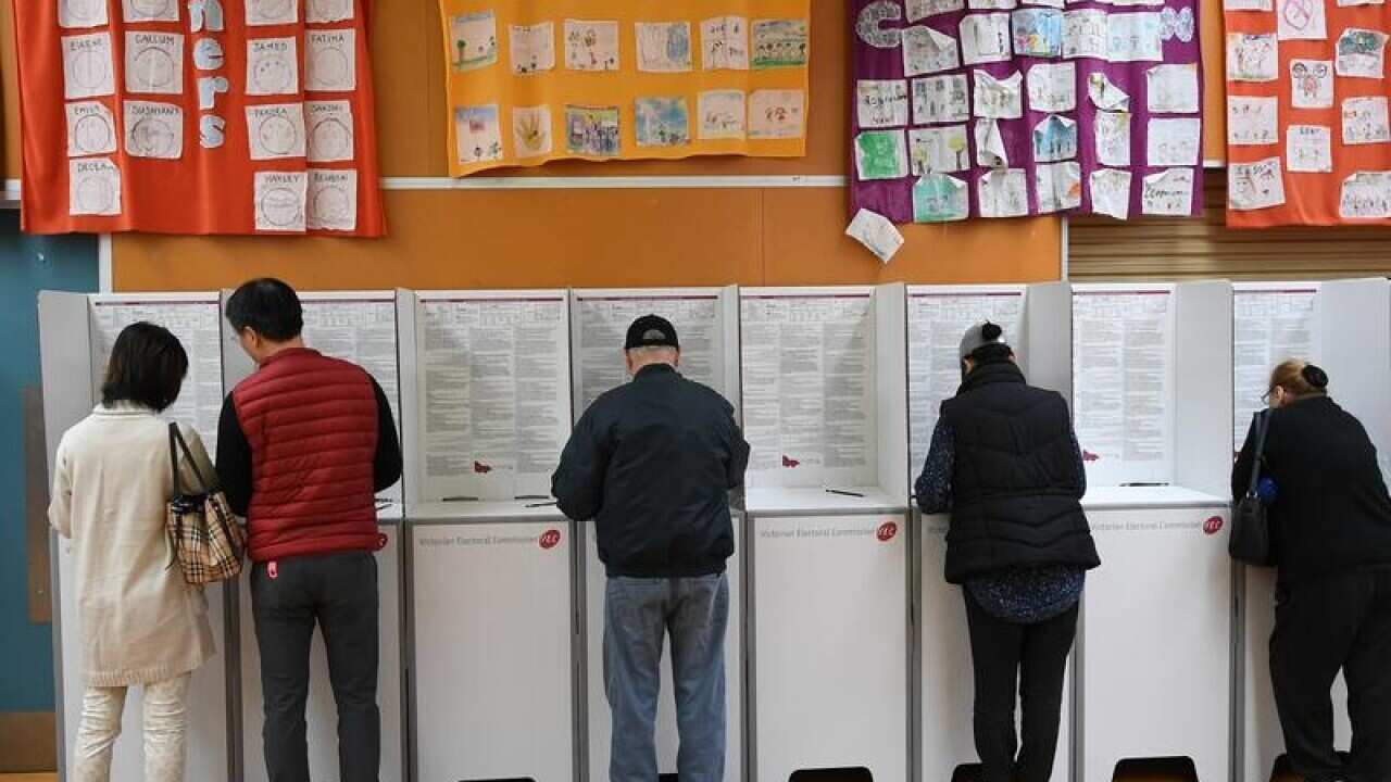 People voting in the Victorian election at a Melbourne school.
