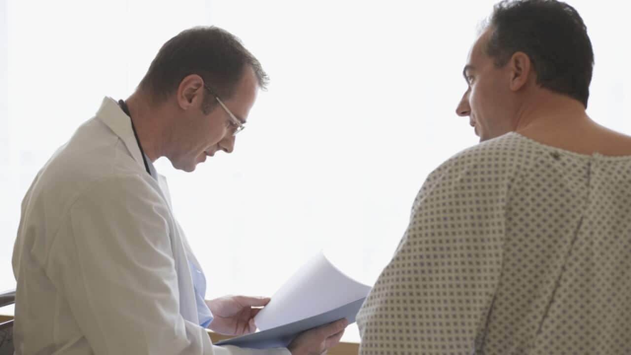 Hospital Doctor With Patient