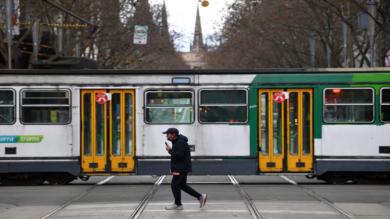 A person wearing a face mask is seen in Melbourne, Friday, 23 July, 2021. 