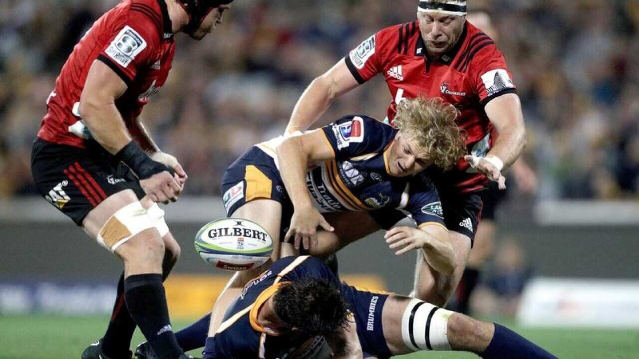 Joe Powell of the Brumbies is tackled.