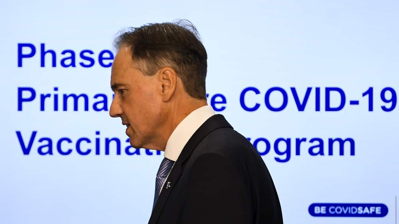 Australian Health Minister Greg Hunt arrives to speak to the media during a press conference at Parliament House in Canberra, Wednesday, March 17, 2021. (AAP Image/Lukas Coch) NO ARCHIVING