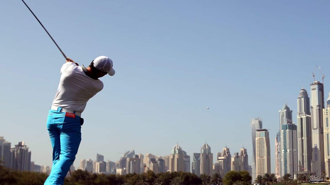 Rory McIlroy tees off in Dubai