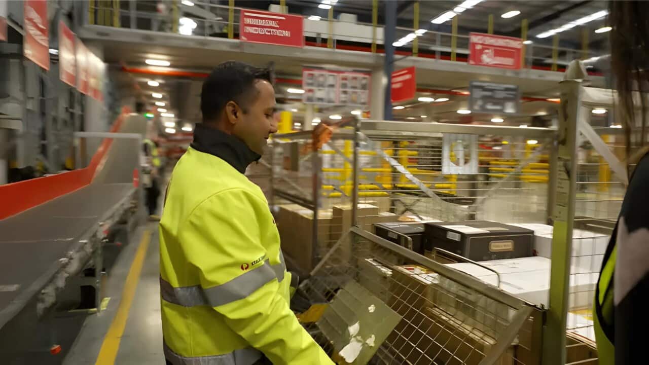 Jerry Cardoza at work at Australia Post (SBS).