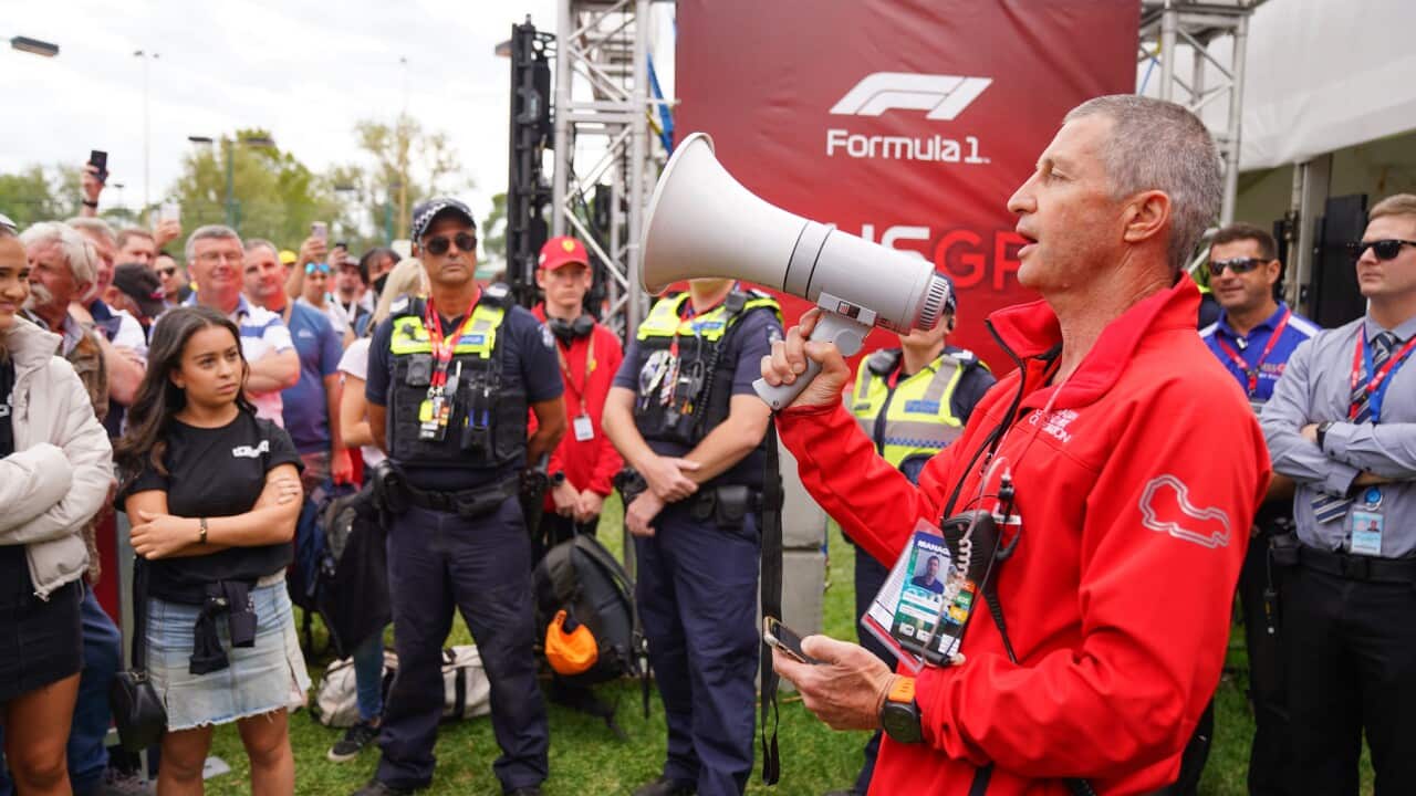 Australian Grand Prix spokesman David Simpson tells waiting fans the event has officially been cancelled