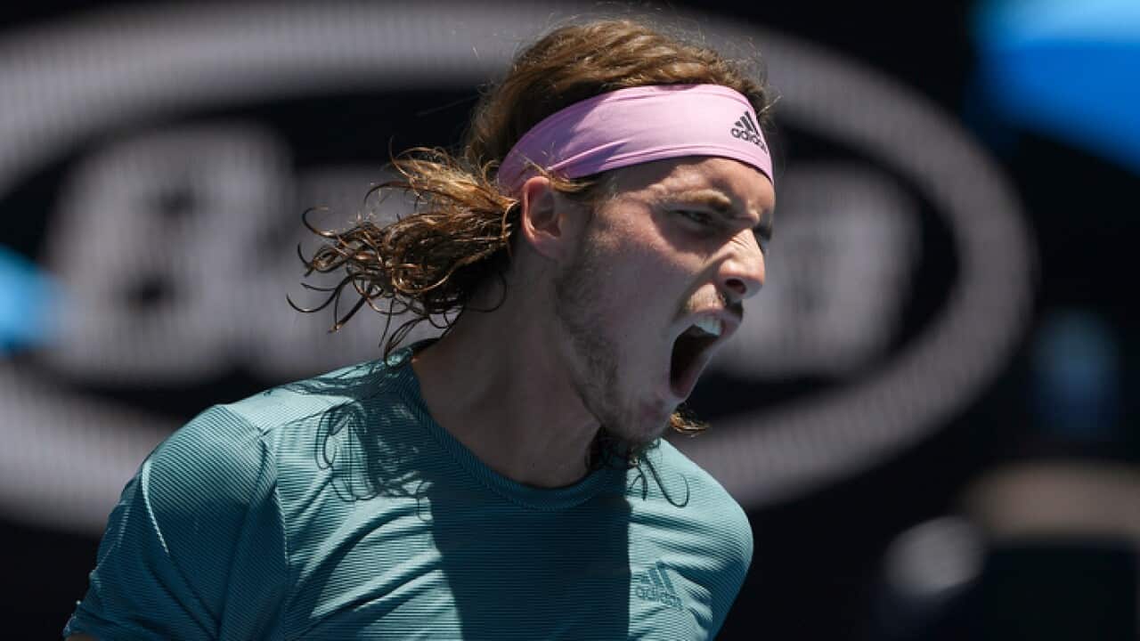 Greece's Stefanos Tsitsipas reacts after winning a point against Spain's Roberto Bautista Agut during their quarterfinal match at the Australian Open tennis championships in Melbourne, Australia, Tuesday, Jan. 22, 2019. (AP Photo/Andy Brownbill)