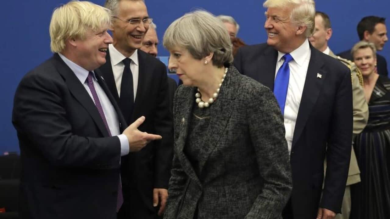 Boris Johnson jokes with Donald Trump at a NATO event in 2017.