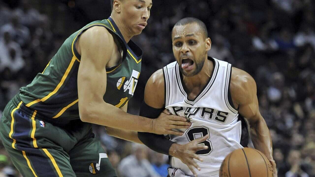 Australian basketballers Dante Exum (L) and Patty Mills