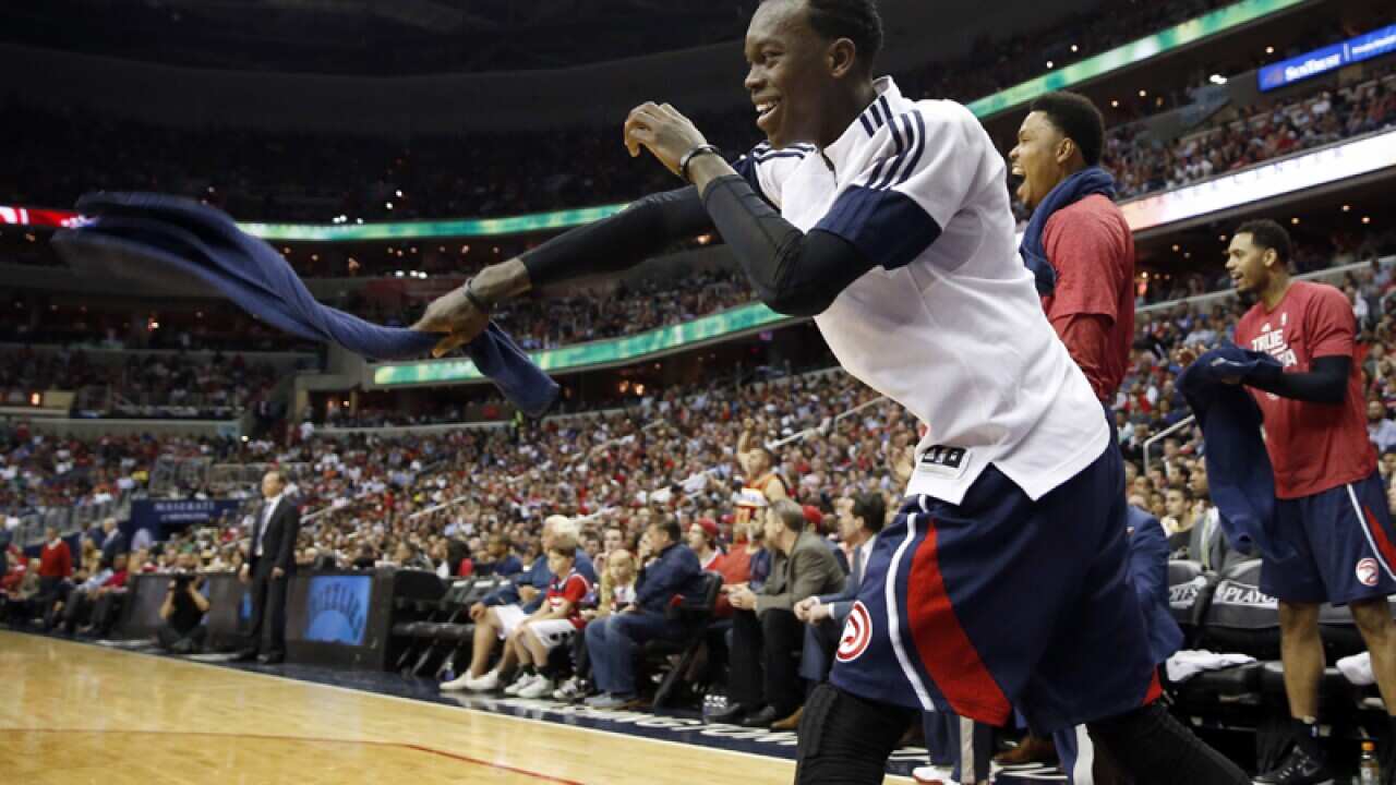 Atlanta Hawks guard Dennis Schroder (L)