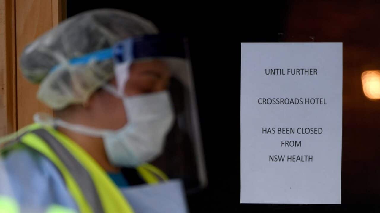 COVID-19 signage is seen at the Crossroads Hotel in Sydney, Saturday, July 11, 2020