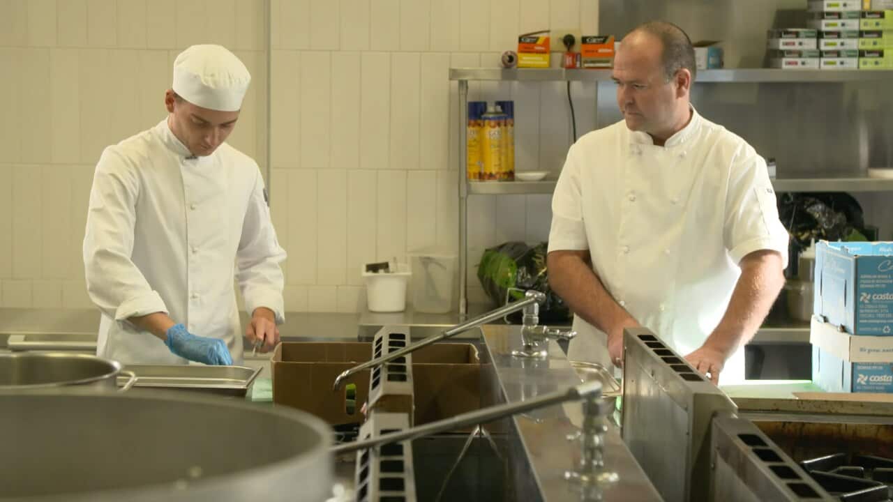 Charcoal lane Apprentice Chef Kody works alongside Executive Chef Greg.