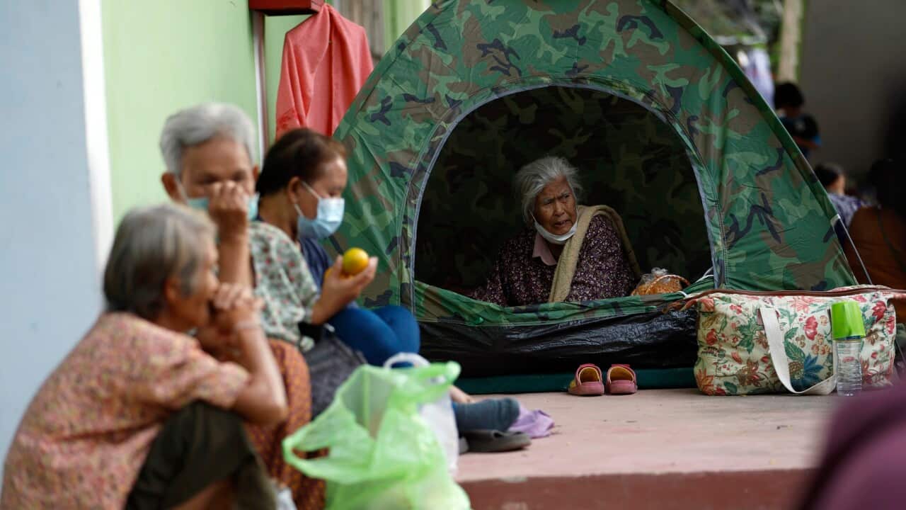 Displaced Thai villagers who fled from homes following clashes between Thai and Cambodian troops, rest at a school turned into an evacuation center in Surin province, Thailand.