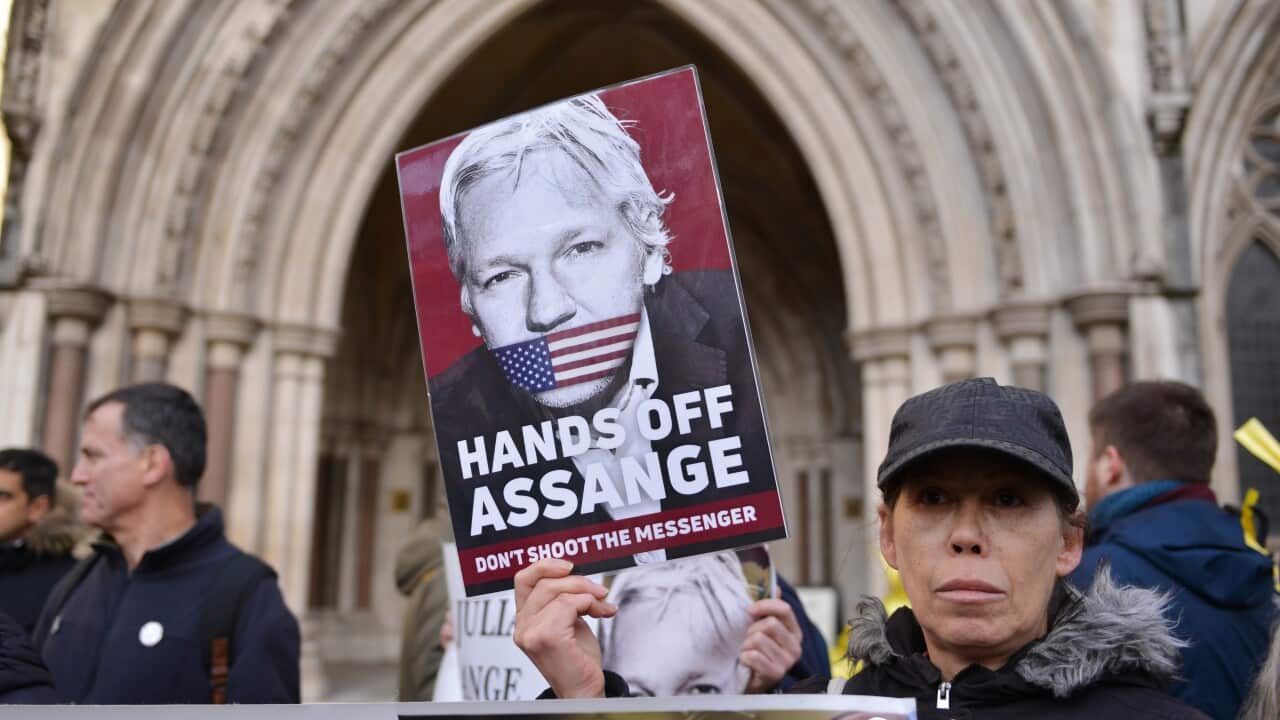 A protester seen with a placard expressing her opinion at the Royal Courts of Justice.U.S wins appeal to extradite Wikileaks founder Julian Assange from the UK. (Photo by Thomas Krych / SOPA Images/Sipa USA)