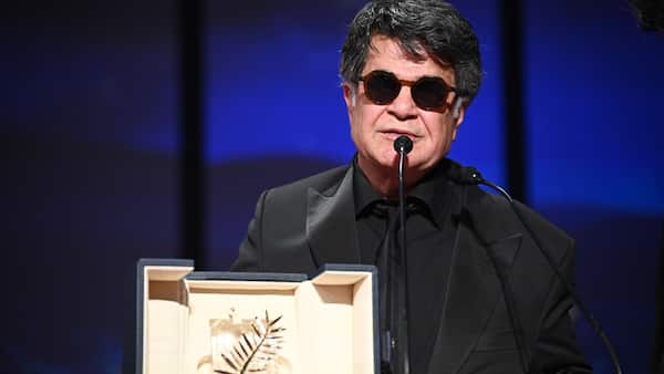 Iranian director wins top prize at Cannes, urging 'unity' and 'freedom' image