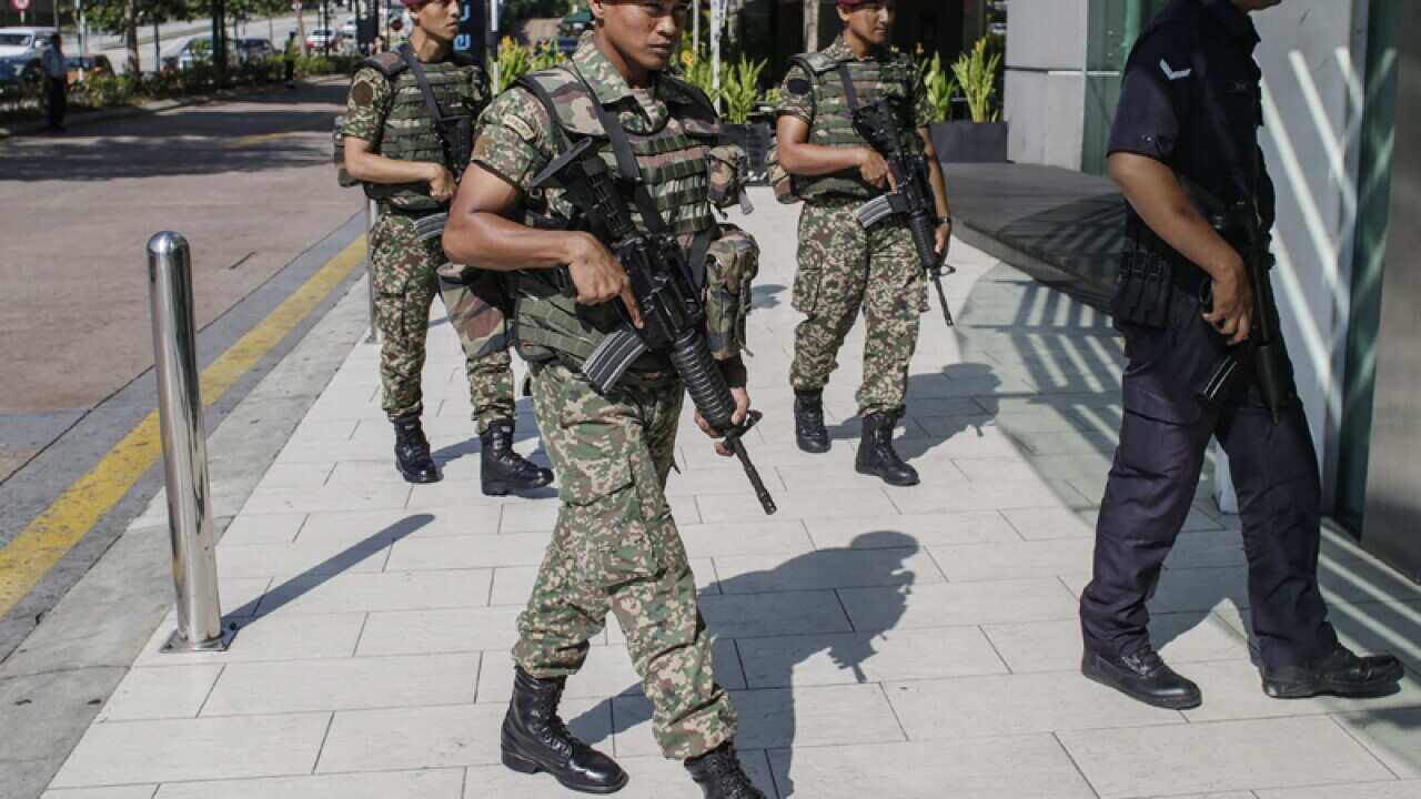 Malaysian Armed Forces with a Royal Malaysian Police patrol