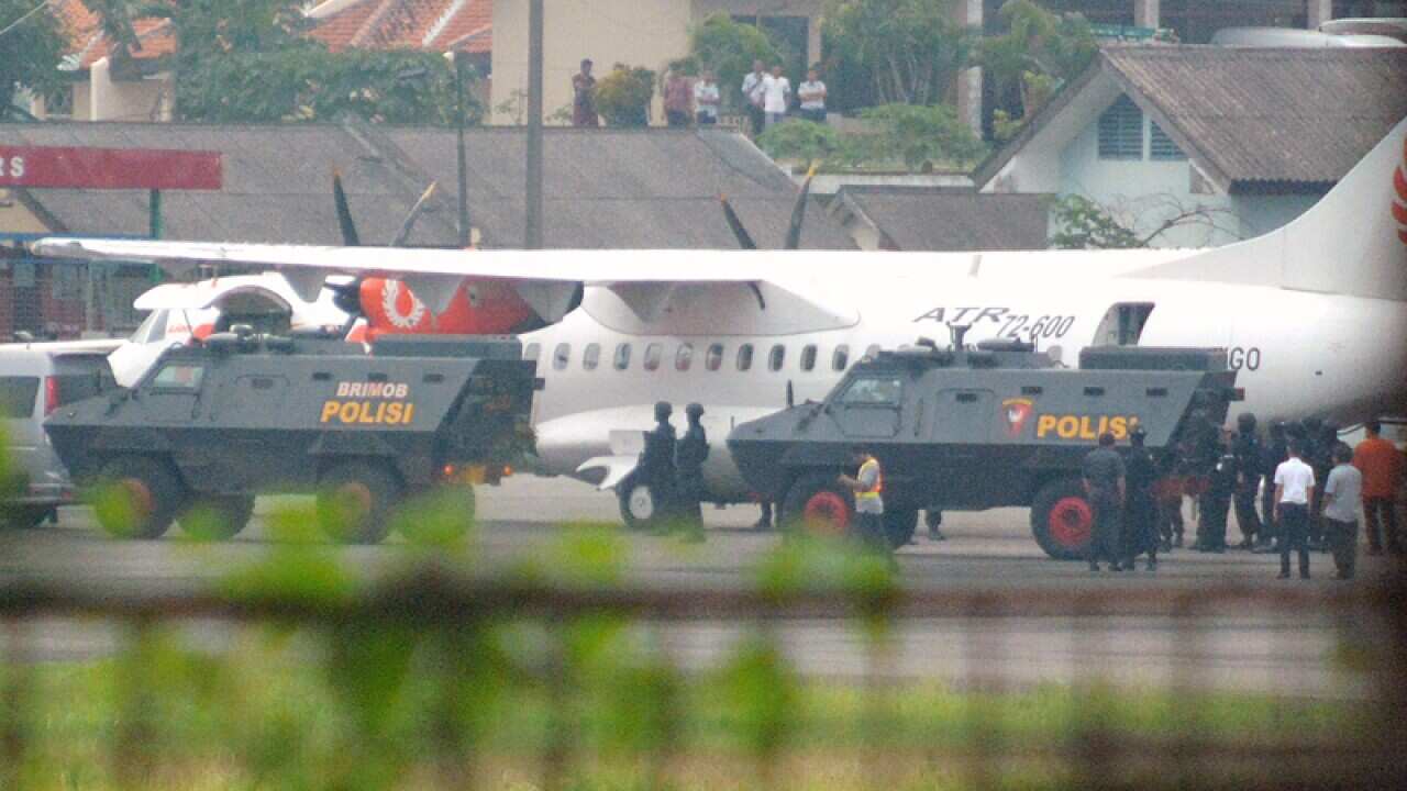 Andrew Chan and Myuran Sukumaran arrive at Tunggul Wulung Airport