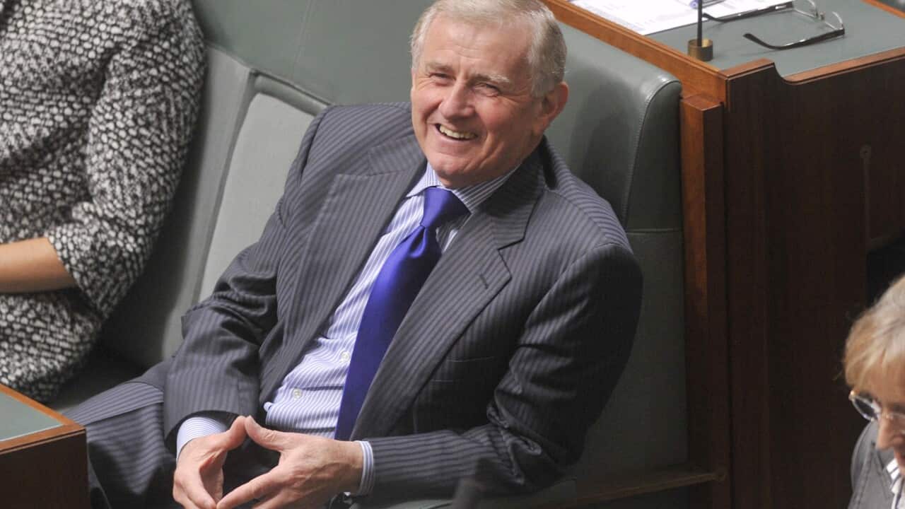Simon Crean smiles during Question Time in federal parliament.