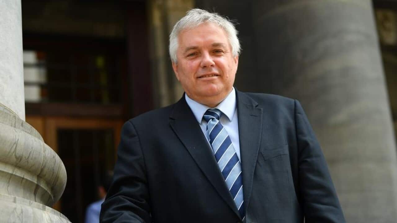Rex Patrick poses for photograph outside South Australian Parliament.