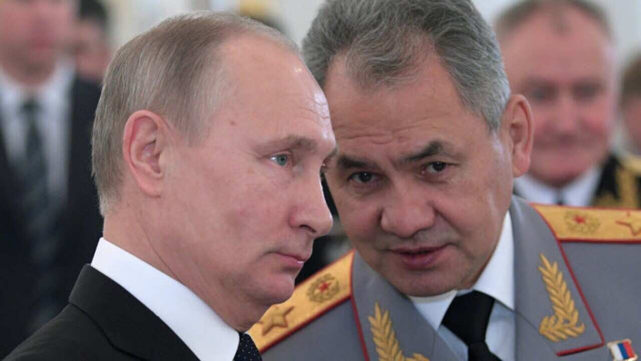 Russian President Vladimir Putin, left, and Defence Minister Sergei Shoigu