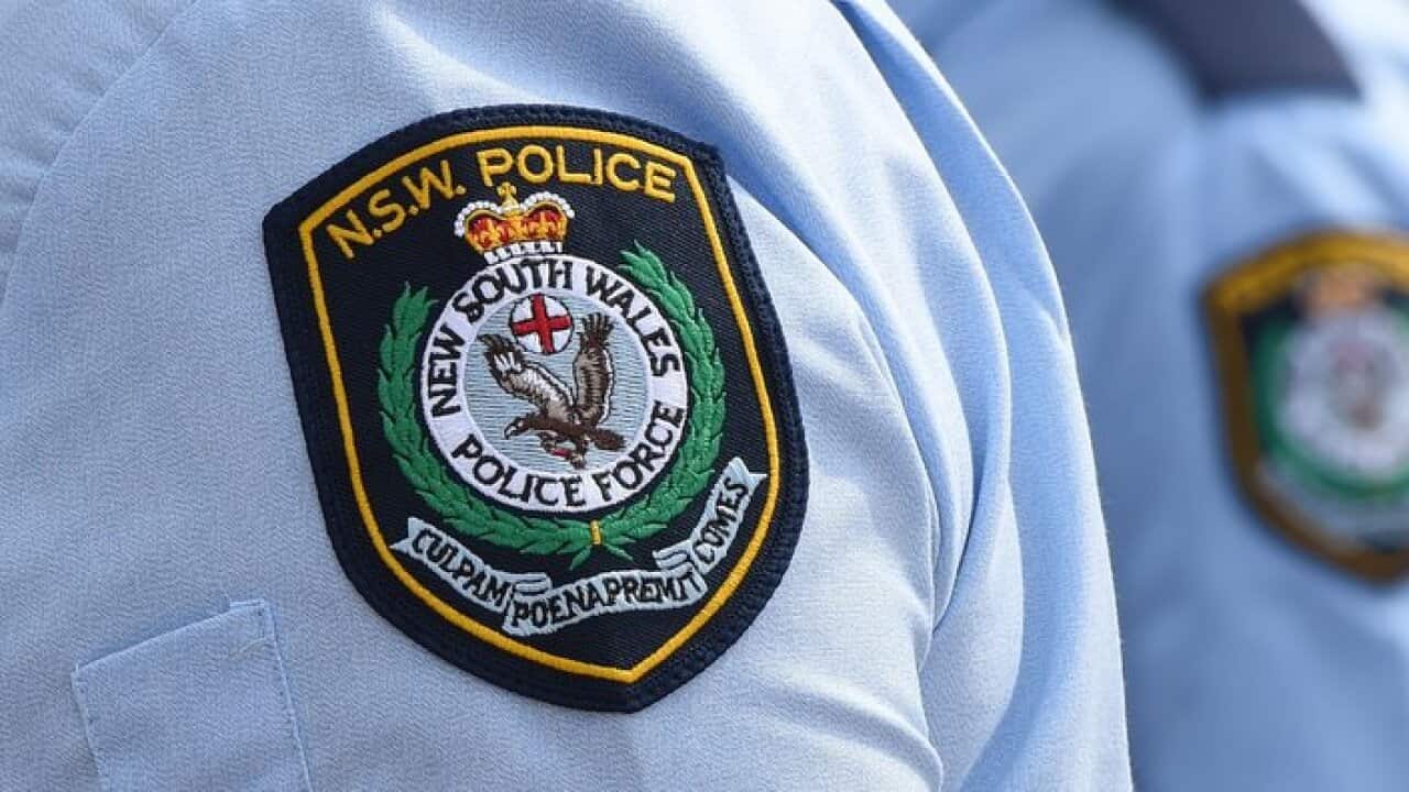 Stock image of New South Wales Police badges in Sydney, Friday, Aug. 16, 2013. (AAP Image/Dean Lewins) NO ARCHIVING