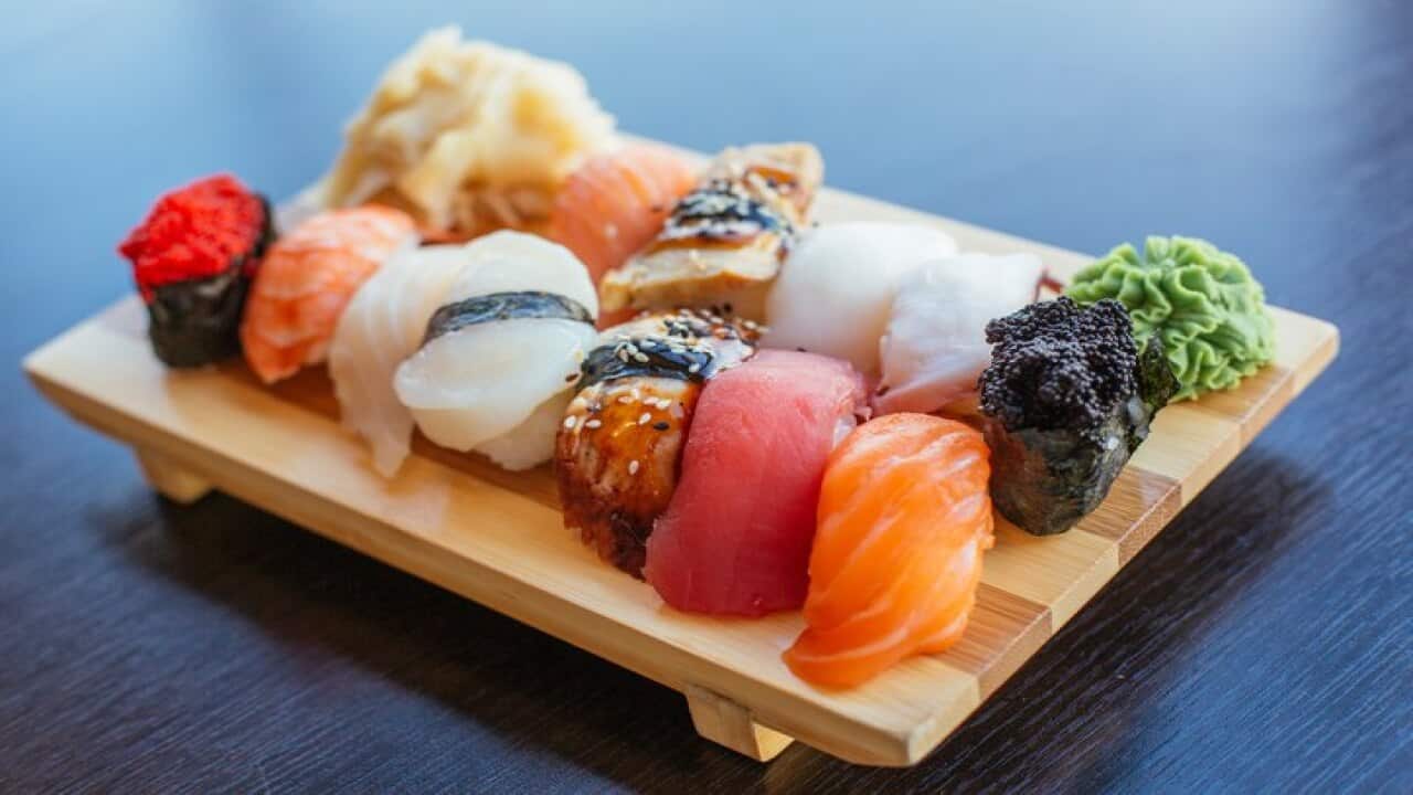 Close-up of sushi set on wooden board