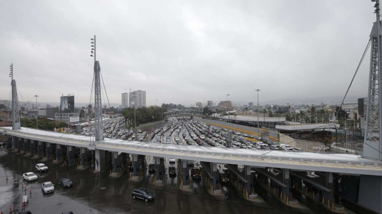 Cars wait to enter the United States from Tijuana, Mexico