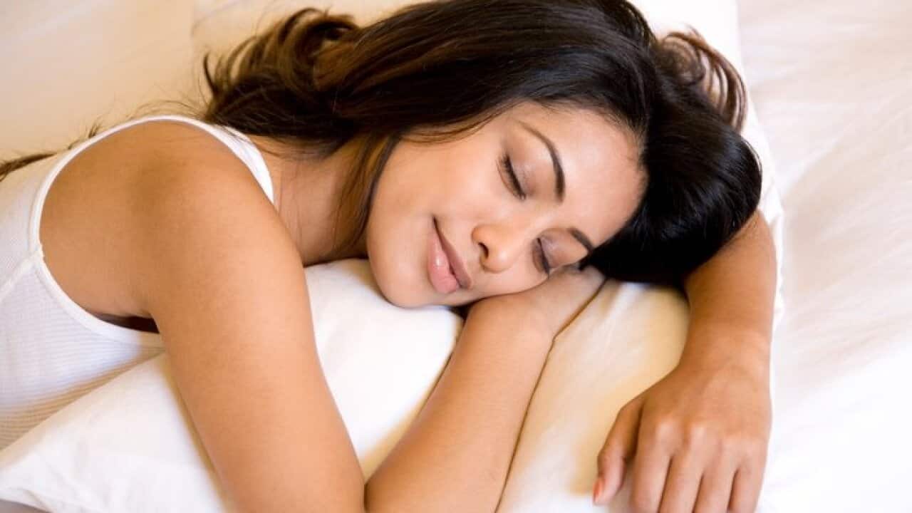 Indian woman sleeping in bed