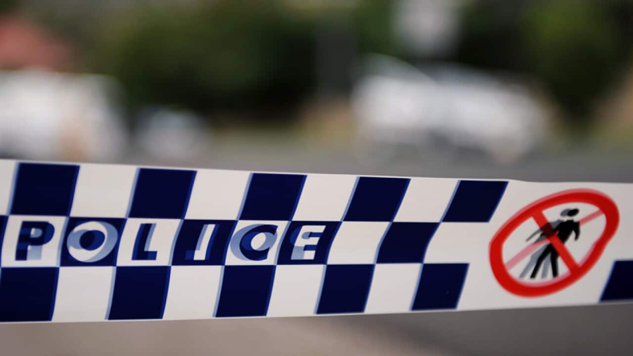 Police tape restricts access to a street in Sydney