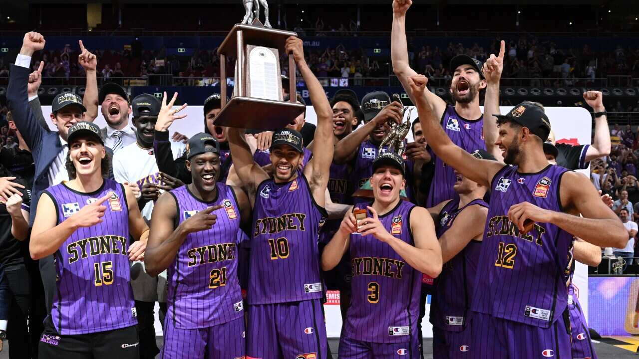 Sydney Kings celebrate after winning in the NBL Grand Final Game 5 against New Zealand Breakers