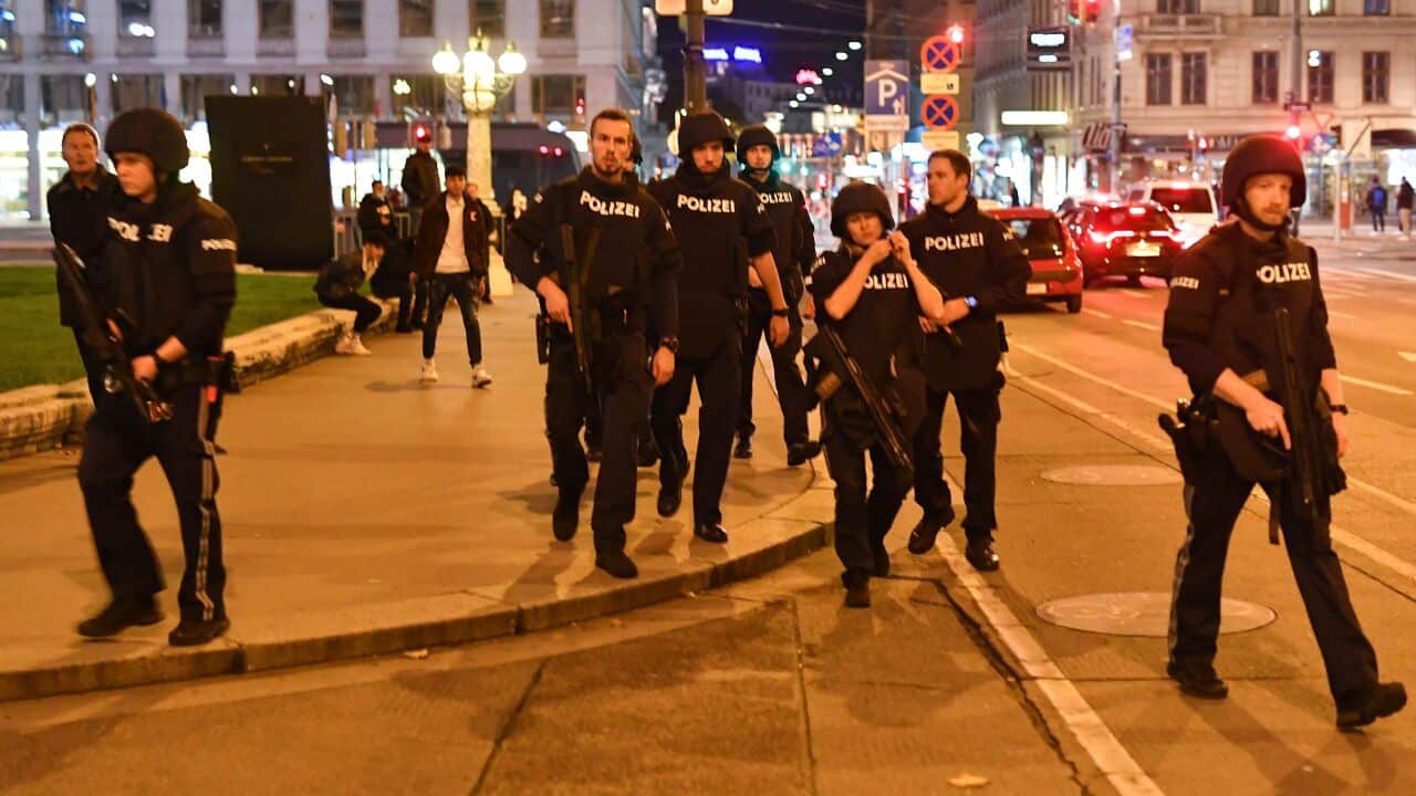 Armed police arrive at the first district near the state opera in central Vienna following a shooting near a synagogue.