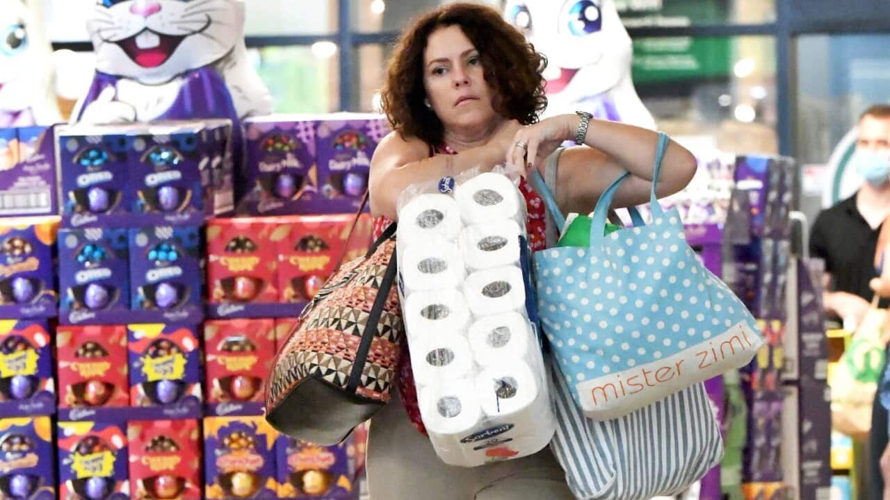 Brisbane residents are seen exiting a grocery store ahead of a 3-day lockdown