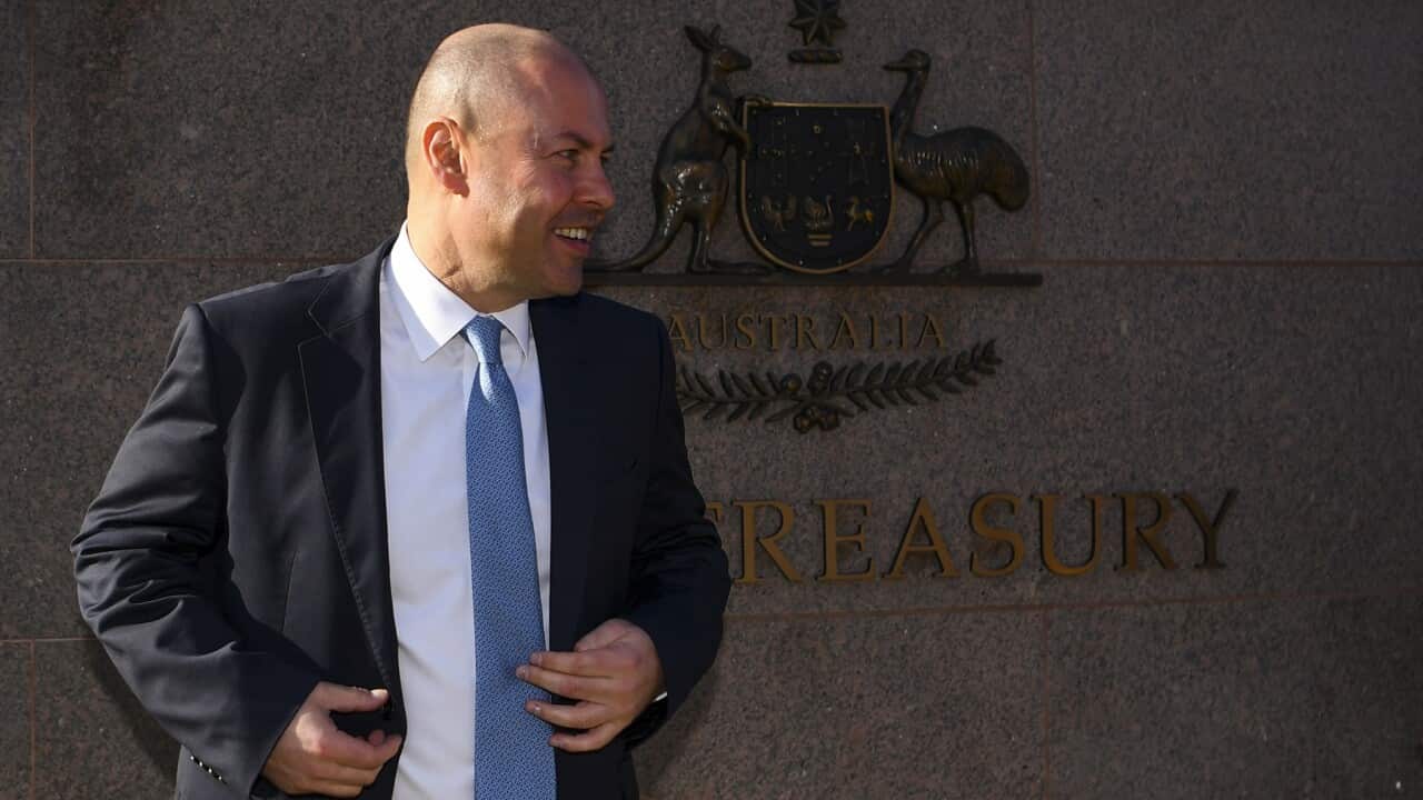 Australian Treasurer Josh Frydenberg poses for photographs outside the Treasury building in Canberra, Monday, May 10, 2021. Treasurer Josh Frydenberg will hand down his third budget tomorrow. (AAP Image/Lukas Coch) NO ARCHIVING