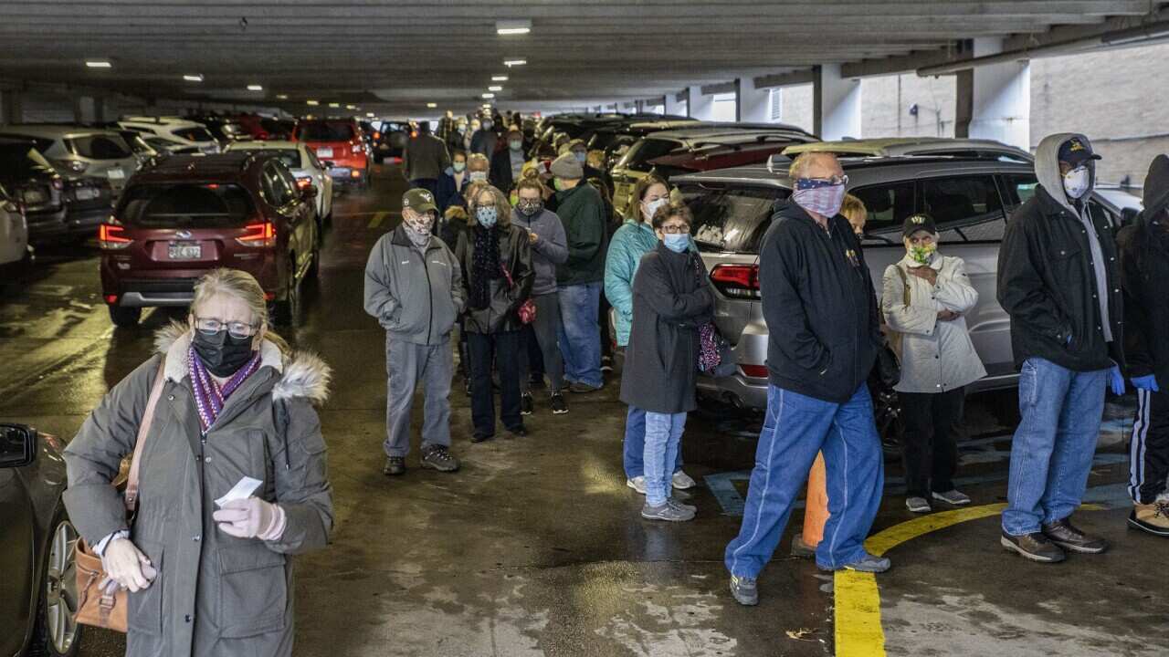 People wait for a COVID vaccination inside in Charleston, S Carolina