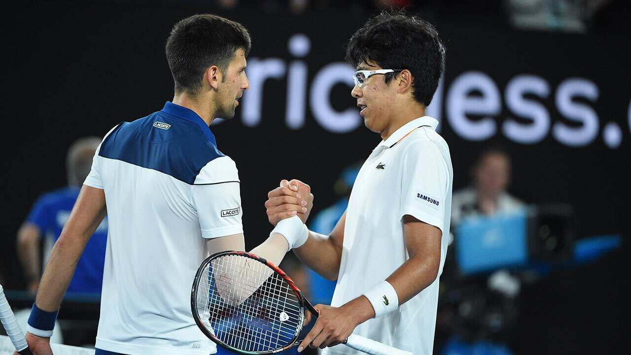 Chung and Djokovic during match at the 2018 Australian Open at Melbourne Park in Melbourne, Australia, on January 22, 2018.