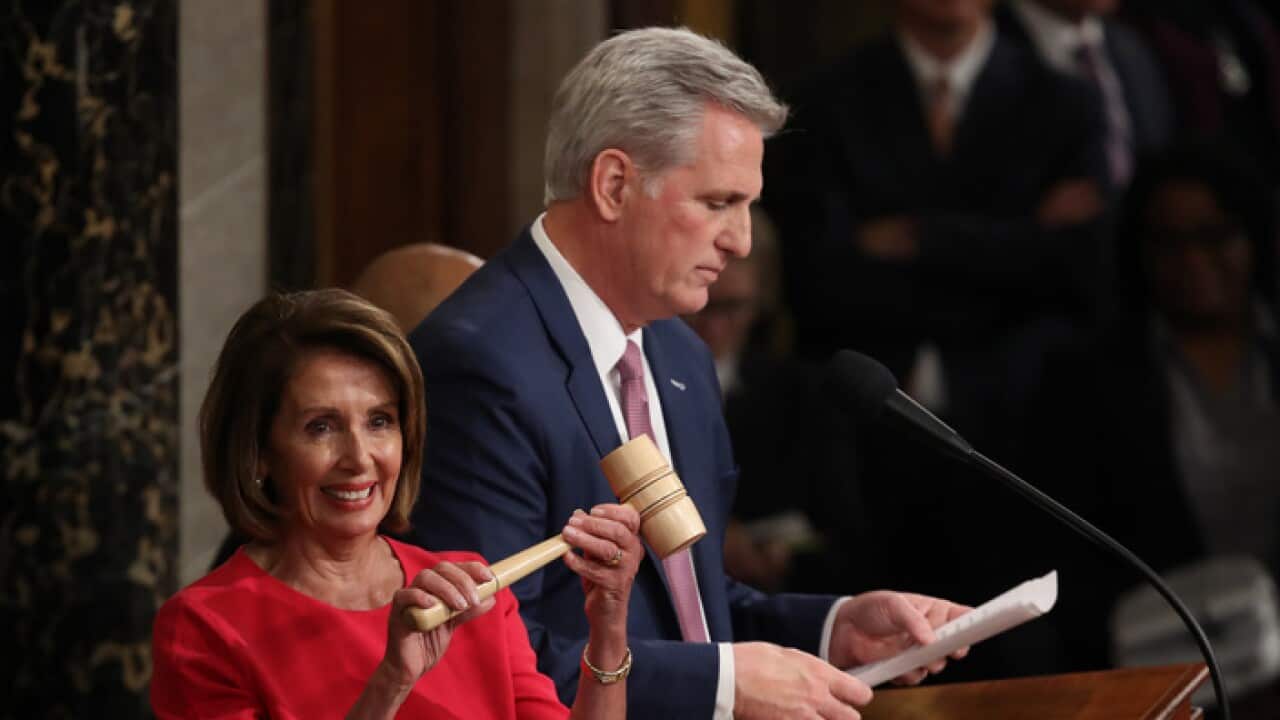 Speaker of the House Nancy Pelosi receives the gavel from Kevin McCarthy following her election